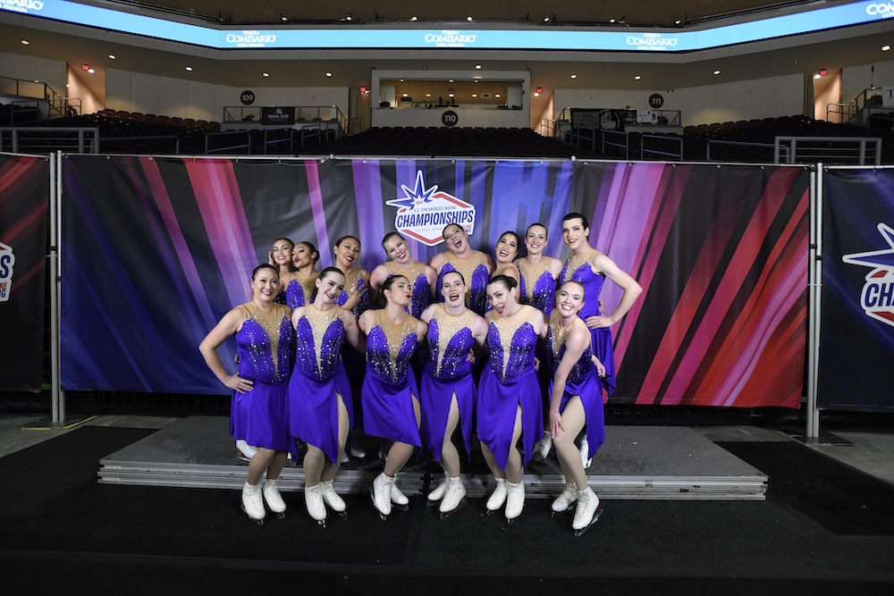 Brooke posing with her team after they received their scores from the judges.